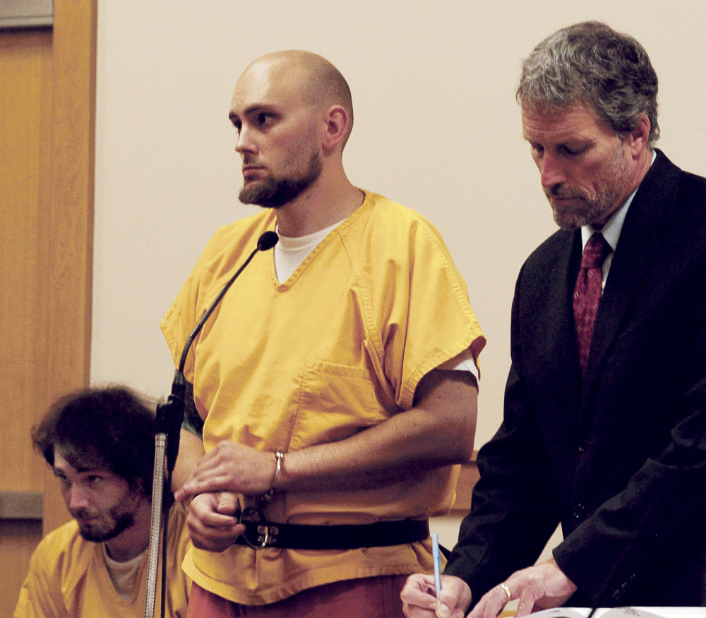 Alexis Casey, center, and his brother, Zachary Casey, attend a hearing on charges of Class A arson in Skowhegan District Court on Oct. 12. Attorney Phillip Mohlar represented the brothers.