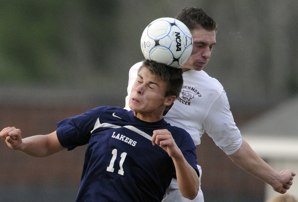 Richmond's Zack Marseglia goes head-to-head with Greenville's Connor DiAngelo (11) during the Class D South regional final Wednesday  in Richmond.