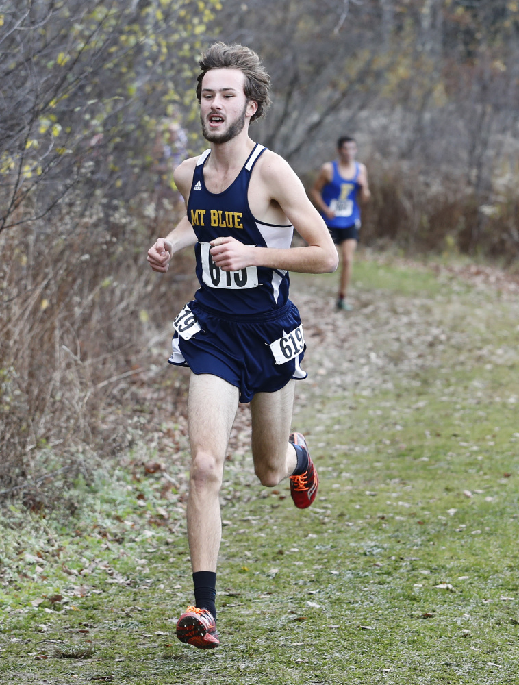 Mt. Blue senior Tucker Barber runs during the Class A state championship race at Troy Howard Middle School in Belfast. Barber won the race.