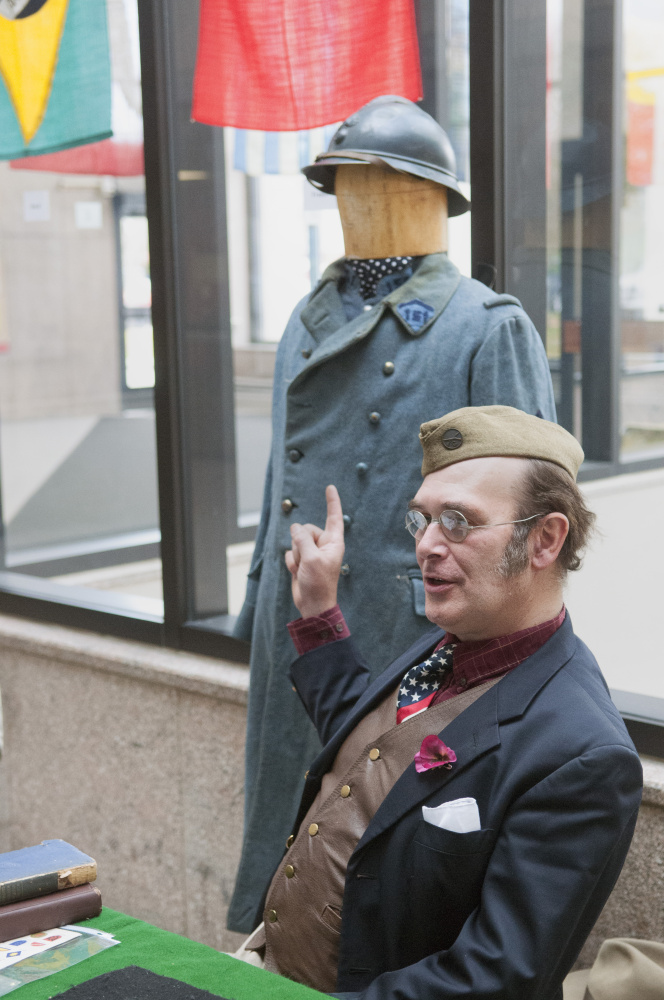 Mark Hilliard, of Heart of Oak Historical Services, talks on Saturday about a French uniform from World War I in the Cultural Building in Augusta.