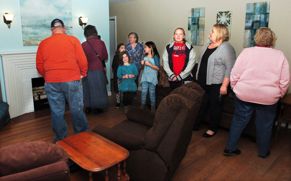 Supporters of Freedom First Support Services take part in a tour Monday during an open house of the Winslow House, the first home in Winslow that creates a learning environment for developmentally disabled people to develop independence skills.