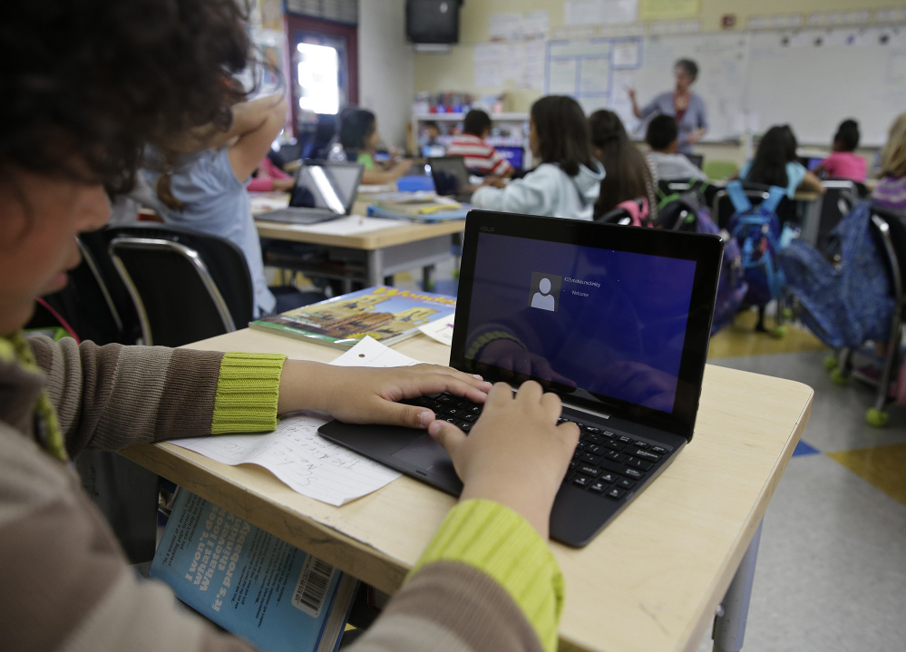 A fourth-grader logs on to complete an exercise at Mira Vista School in Richmond, Calif., in 2015. A new survey of nearly 1,800 parents in the U.S. shows that 94 percent believe technology is helpful for children's education.