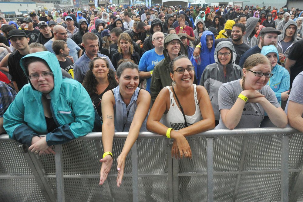 Fans listen to Chuck Regan, opening act for the Irish rock band Flogging Molly, at the Maine State Pier in August. Some neighbors say the loud music hurts their quality of life.