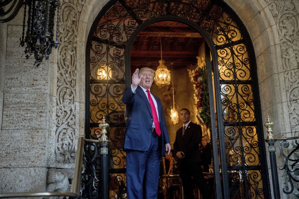 President-elect Donald Trump waves to members of the media after a meeting with admirals and generals from the Pentagon at Mar-a-Lago, in Palm Beach, Fla., last week.