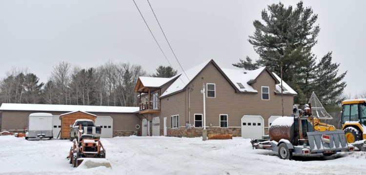 The home at 160 Drummond Ave. in Waterville is seen Dec. 29, 2015, three days after the body of Stacey MacDonald was found outside the building. MacDonald accidentally fell from the second story of the home because a balcony hadn't been built outside a sliding glass door.