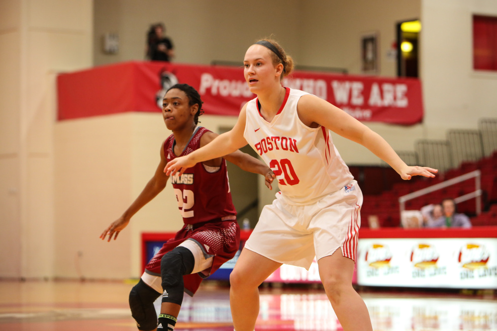 Nia Irving looks to get postinioning on UMass sophomore guard Jessica George during a Dec. 14 game in Boston.