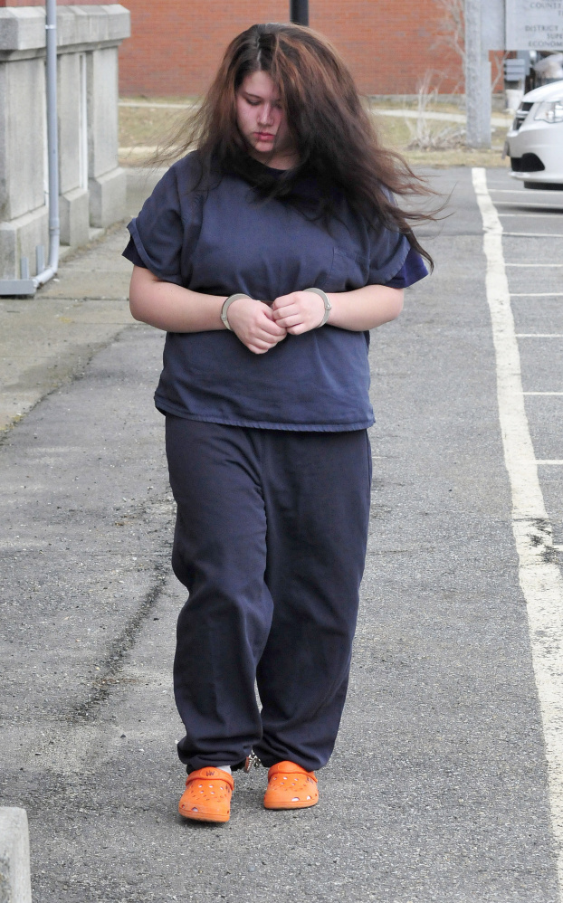 Kayla Stewart of Fairfield is led into Somerset County Superior Court in Skowhegan for the trial in the death of her newborn child on Tuesday.