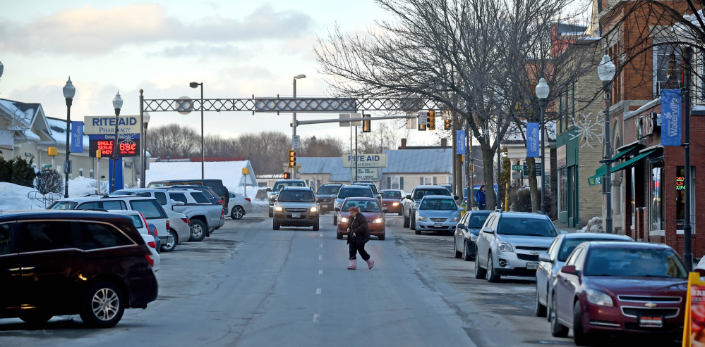 Traffic flows south Friday on Main Street toward the Bridge Street intersection in Waterville. A new traffic study proposes how two-way traffic could resume on Main Street as part of downtown revitalization efforts.