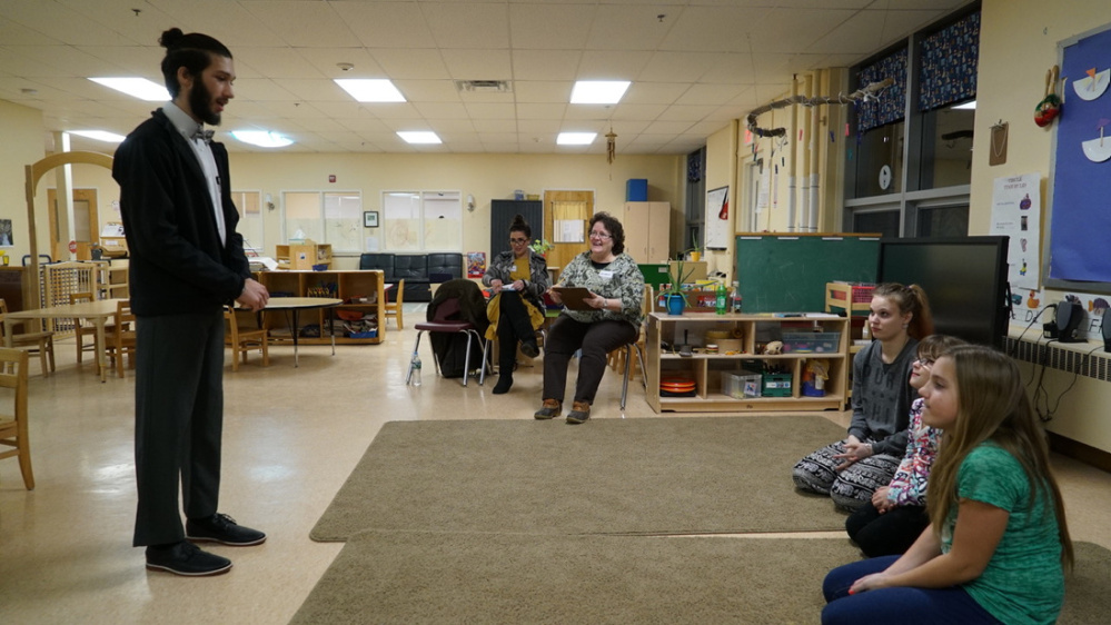 Djimon Santos, left, who attends the Mid-Maine Technical Center in Waterville, took part in the Local Skills Championship on Jan. 11 in Waterville. He won the Gold Medal in the Preschool Teaching Assistant category. Judges, center, were Jennifer Nesbitt and Cindy Mason. Children, far right, include Kaytlyn Simpson, Skyler Holt and Michaela Demers.