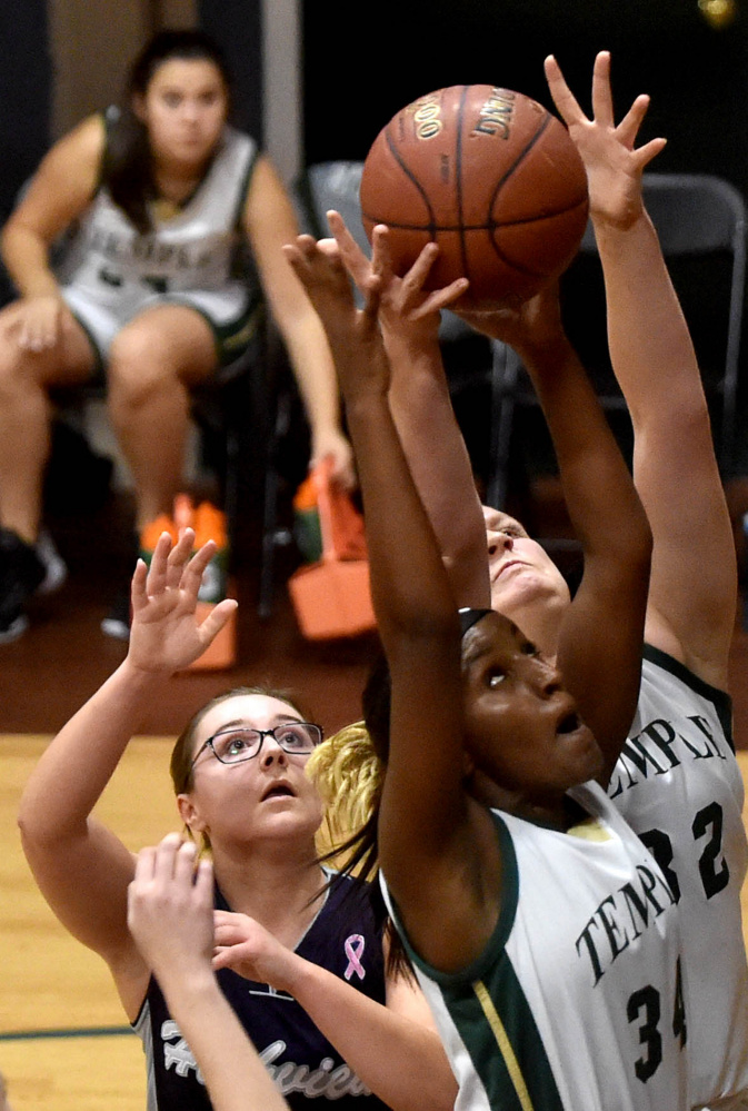 Temple's Selam Heinrich (34) grabs a rebound during a Class D South game Friday afternoon against Highview Christian in Waterville.