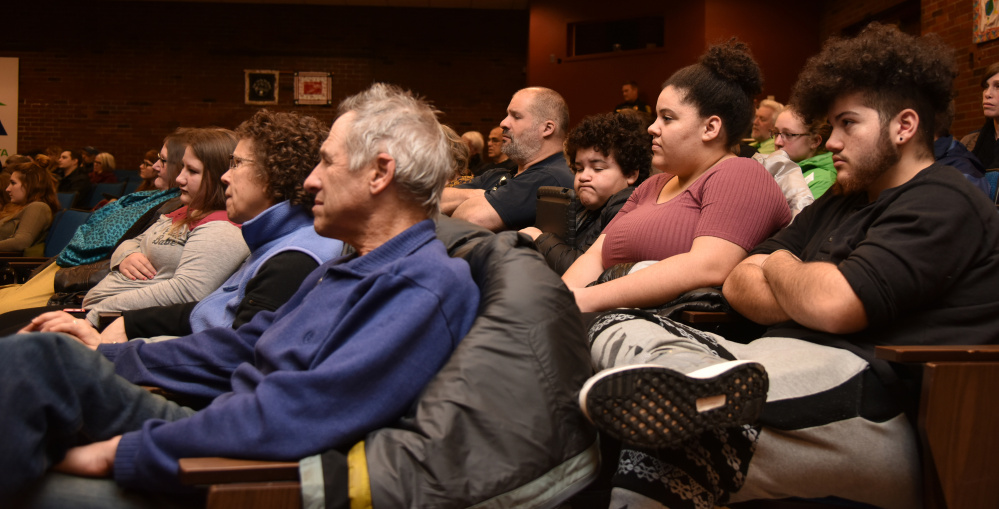 Audience members listen to speakers Wednesday night at a forum held at the University of Maine at Augusta in response to Ku Klux Klan fliers placed in Augusta and in other Maine communities.  District Attorney Maeghan Maloney led the forum, which featured UMA professors, immigrant community leaders and Maine Attorney General Janet Mills as speakers.