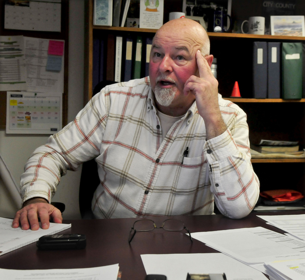 Waterville Public Works Director Mark Turner speaks Monday morning about plowing duties during the snowstorm, saying he has been working since Sunday orchestrating the dozen city plow trucks clearing snow.