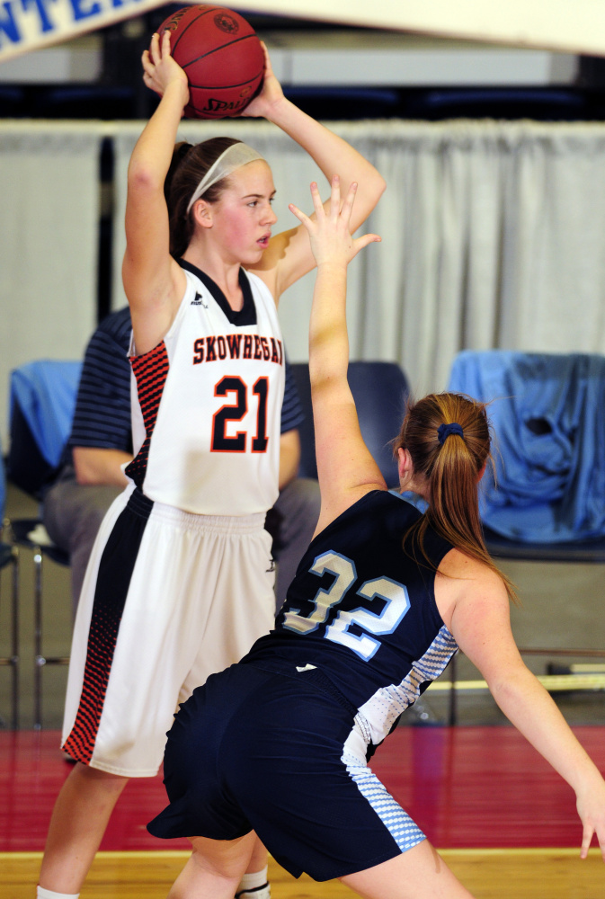 Skowhegan's Annie Cooke (21) looks for a teammate to pass to around Oceanside's Alexis Mazurek during a Class A North quarterfinal game Friday at the Augusta Civic Center.