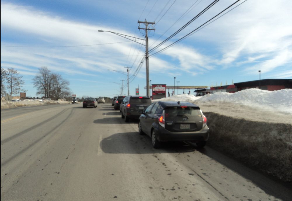 A line of vehicles waits to use the car wash Tuesday at J&S Oil off Kennedy Memorial Drive in Waterville. The photo was taken by a police officer who was patrolling the area and asking people to move.