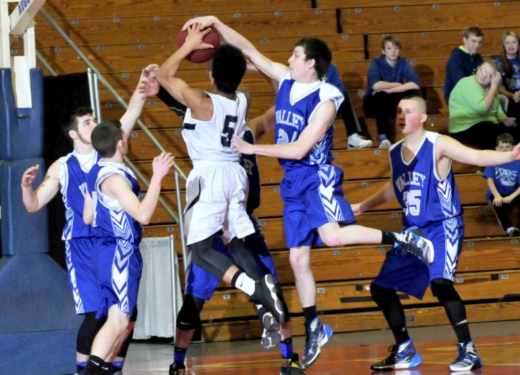 A.R. Gould's Joe Clement is blocked and surrounded by Valley players from left, Keegan Farnham, Joey Thomas, Austin Cates and Mason Wyman, during a Class D South semifinal Wednesday at the Augusta Civic Center.