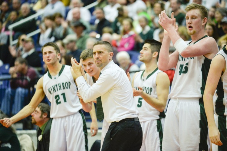 Winthrop head coach Todd MacArthur and his team celebrate a call in the fourth quarter of a Class C South semifinal Thursday. The Ramblers topped North Yarmouth Academy 52-29.