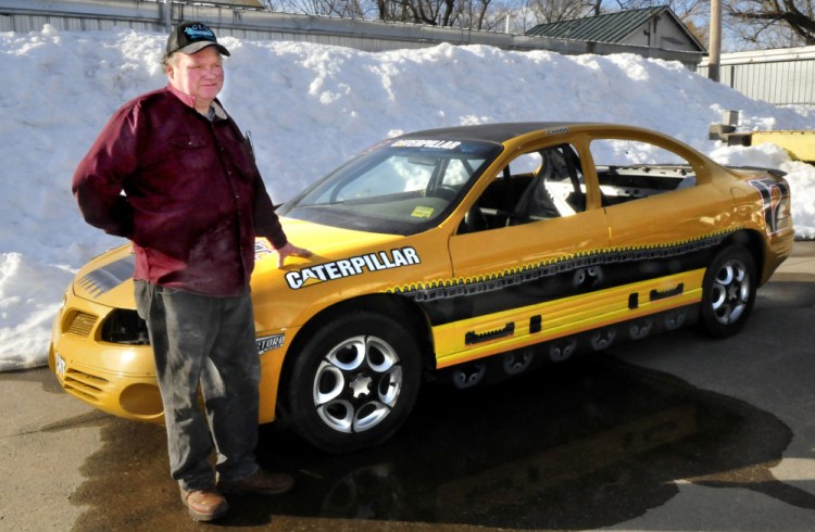 George Fernald, owner of Unity Raceway, has plans for this season at the race track as he shows off a stock car he built at his shop in Benton on Wednesday.