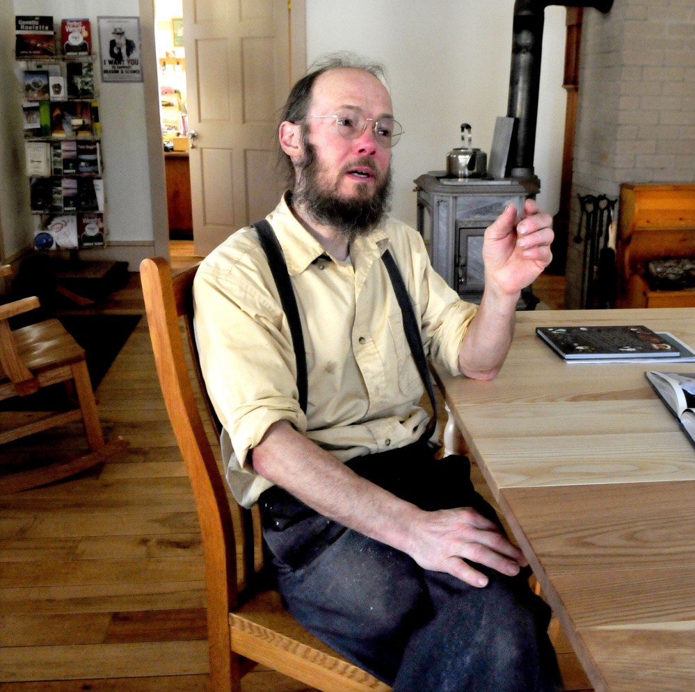 Woodworker Ken Copp speaks from inside his Locust Grove Woodworks shop in Thorndike on Wednesday. Copp said he believes the community is defined historically by agriculture and farming and not by enterprises like car racing at Unity Raceway.