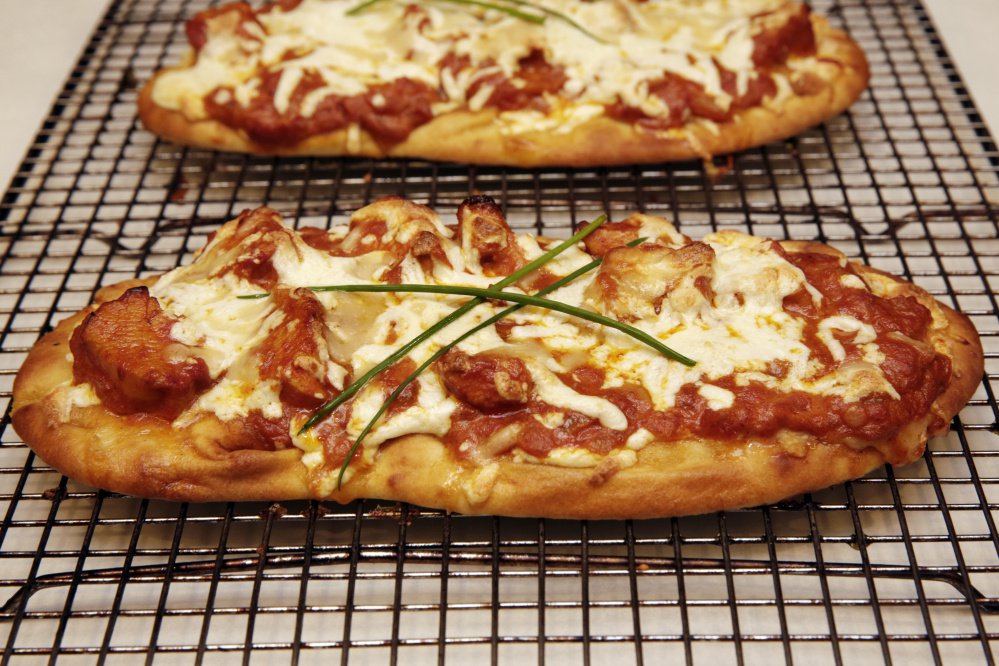 The small size and light and airy texture of store-bought naan make it a shoe-in for a quick pre-made pizza crust.