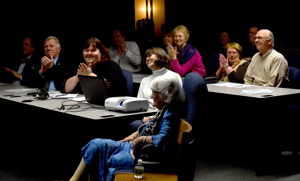 People applaud Hope Wing Weston on Wednesday as she is introduced during a presentation about her father, Eugene Wing, by the Fairfield Historical Society at the Lawrence Junior High School library in Fairfield.