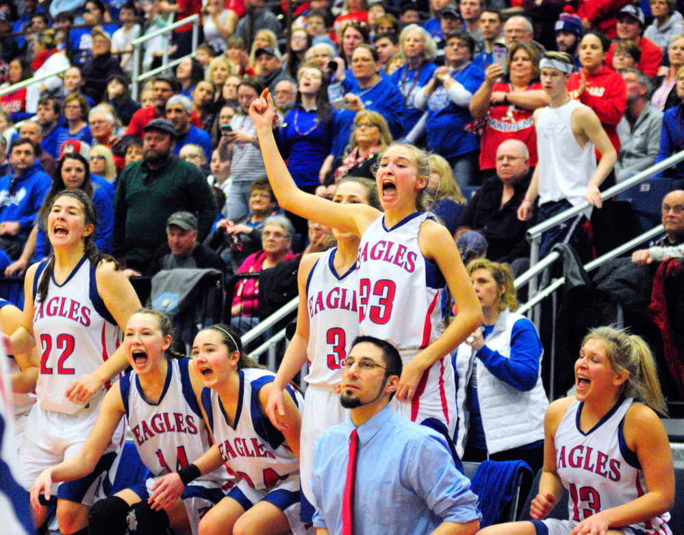 Messalonskee's bench and fans celebrate just before the clock runs out in the Class A state final Saturday at the Augusta Civic Center. The Eagles beat Brunswick.