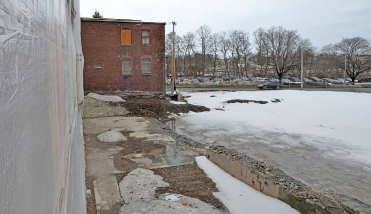 A view of the site, seen Tuesday, for a proposed boutique hotel on Main Street overlooking a city-owned parking lot on Front Street in Waterville.