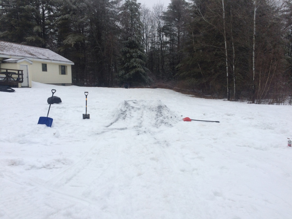 The scene of a residence on Hinckley Road in Canaan, where a teenager broke his leg after attempting to jump off a friend's homemade snow ramp on a snowmobile.