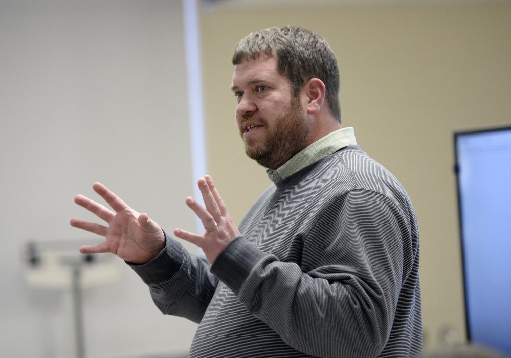 Michael Lamoureux teaches the adult computer literacy class at the center in Gray. He works with eight students at a time on topics such as email etiquette and downloading files. "We create an open environment," Lamoureux says. Staff photo by Shawn Patrick Ouellette