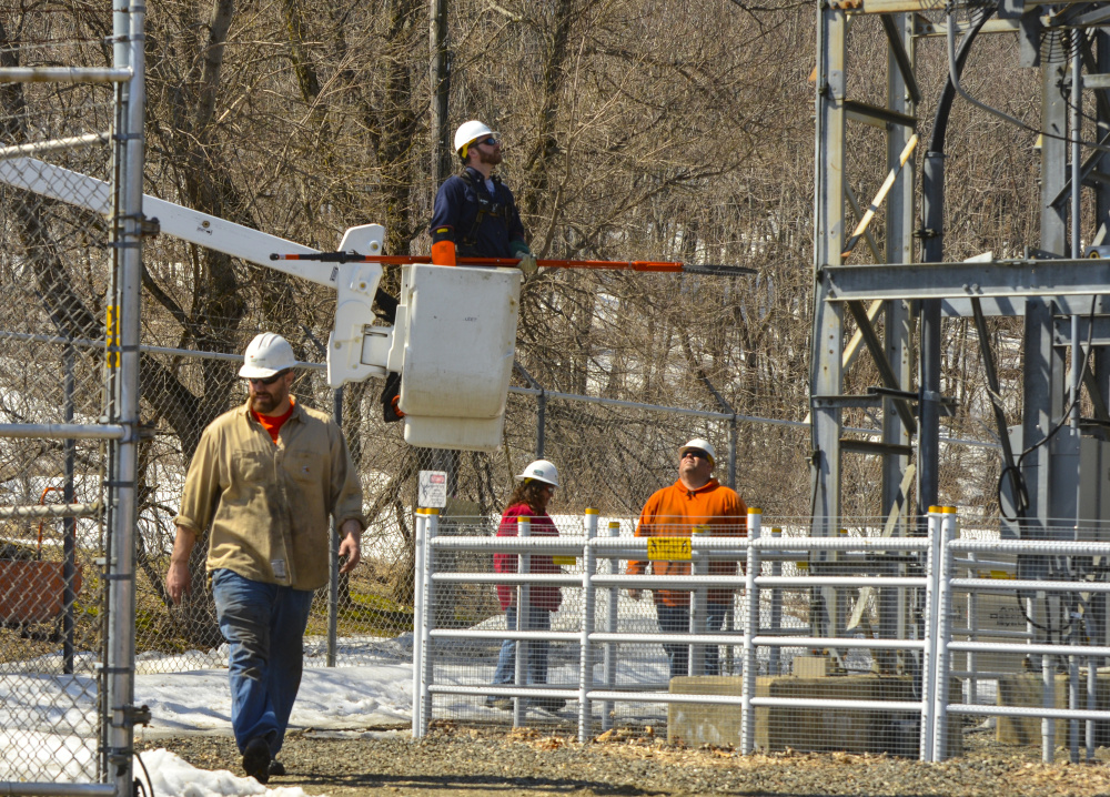 A crew from Central Maine Power completes repairs and maintenance Monday at a substation on Mount Vernon Avenue at Bond Brook in Augusta following an equipment failure Sunday night. Although some speculated the failure might have been the source of a loud boom heard in the area, a CMP spokeswoman said the sound and outage are not related.