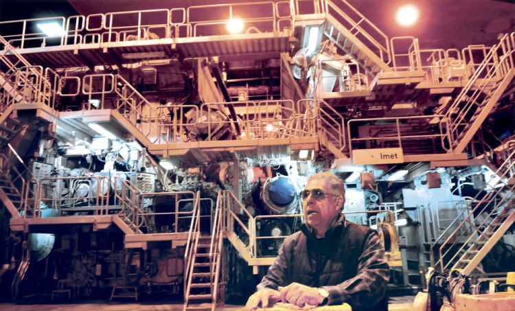 Jaime Broce of Somerset Acquisition LLC and current manager of the former Madison Paper Industries mill gives tours of the mill and its assets, including the No. 3 paper-making machine behind him Wednesday that along with other mill assets is for sale as working equipment or as a last resort scrap.