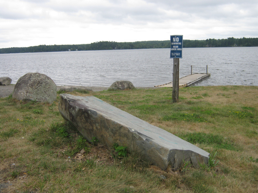 Signs of civilization on the shore of Lake Winnecook, Unity, in the Maine woods.