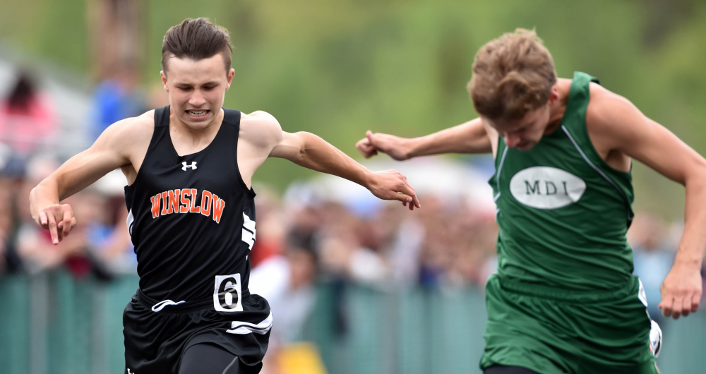 Staff file photo by Michael G. Seamans 
 Winslow's Jake Warn, left, has been part of a group that has the Black Raiders eyeing success in the conference and state meets later this spring.