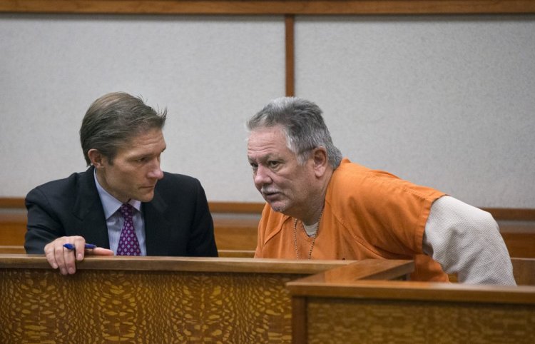 Theodore Thomes confers with his attorney, Devens Hamlen, during a bail hearing Tuesday at the Cumberland County Courthouse in Portland.