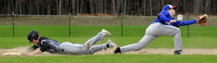 Bridgeway's Sean Whalen slides into second base against  Oak Hill on Wednesday in North Anson.