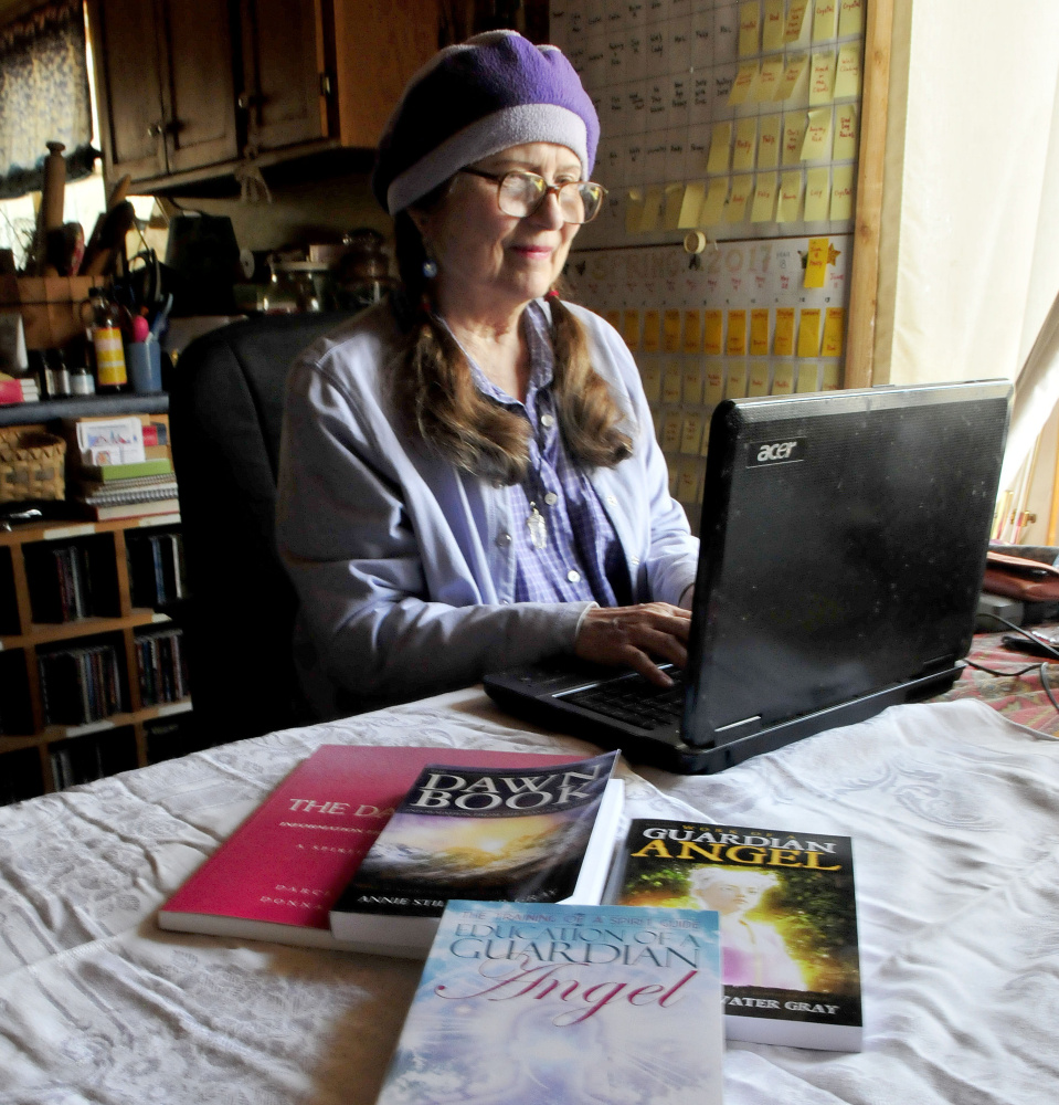 Author and mystic Annie Stillwater Gray works on a manuscript Thursday at her home in Solon.