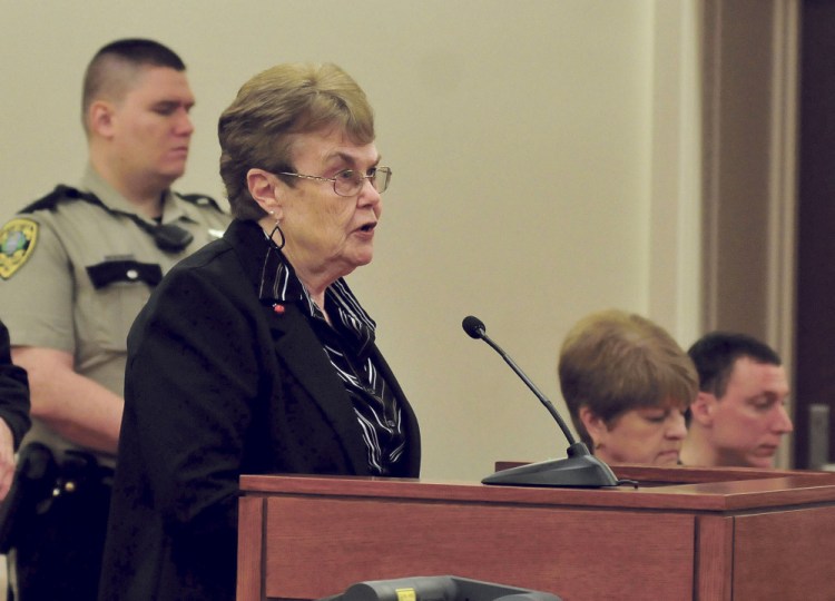 Assault victim Linda Alderson speaks Monday during a hearing at the Capital Judicial Center in Augusta where Mark Halle, far right, was sentenced to 27 years in prison. Beside Halle is his attorney Pamela Ames.