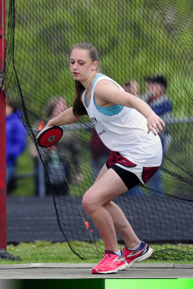 Monmouth's Maddie Amero throws the discus during a meet.