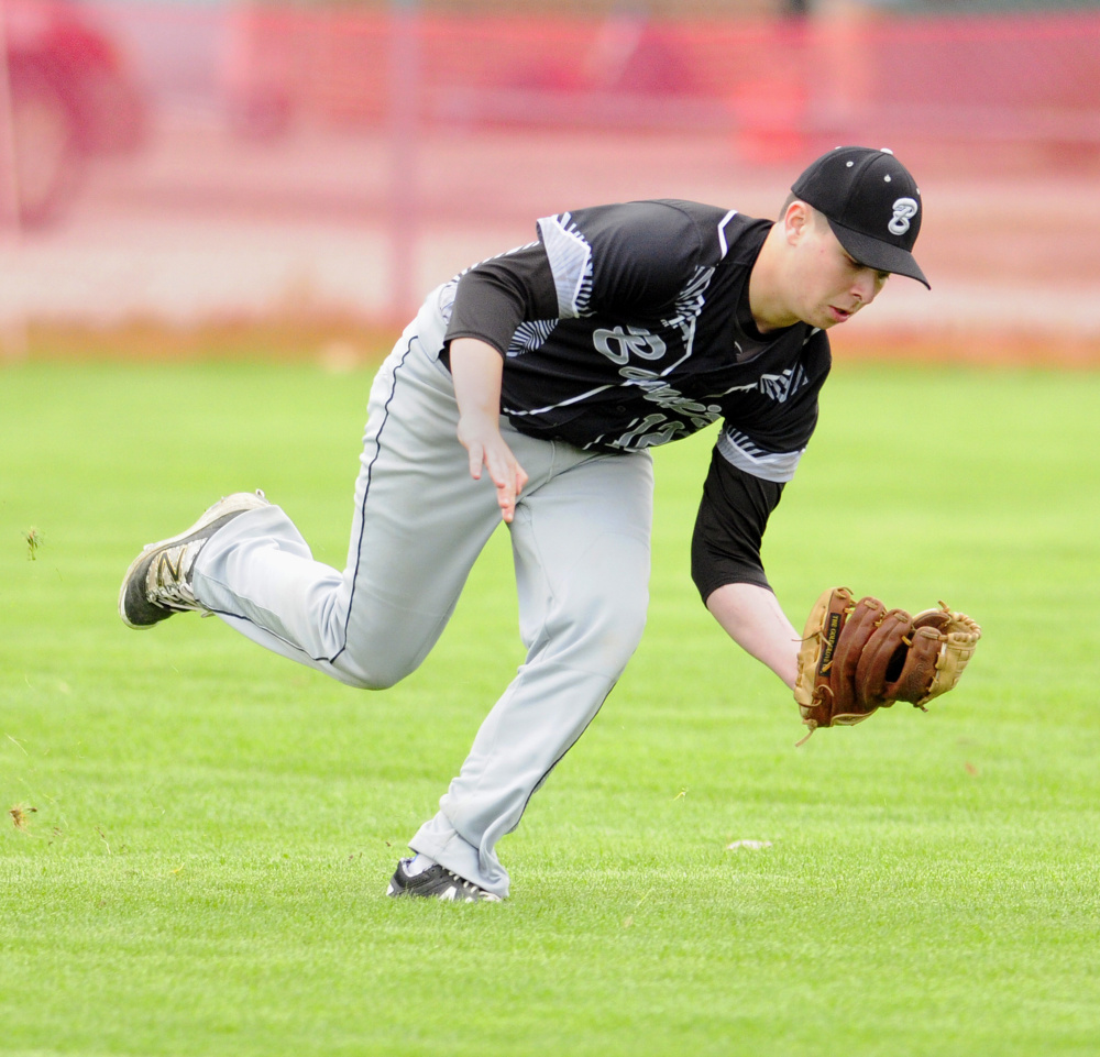 Bridgeway right fielder Zach Belanger snags a pop fly during a game at Hall-Dale earlier this season.