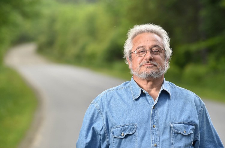 Bruce Keezer stands at 129 Goodrich Road in Clinton, where he lives, on Thursday. Keezer relies on the Kennebec Valley Community Action Program to get to Waterville from his rural home in Clinton for medicine and other supplies.