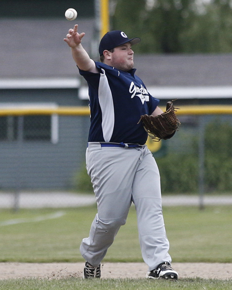 Photo by Dean Denis 
 Gardiner's Casey Dion fields the ball and throws out Augusta's Austin Stebbins during an American Legion baseball game Thursday in Augusta.