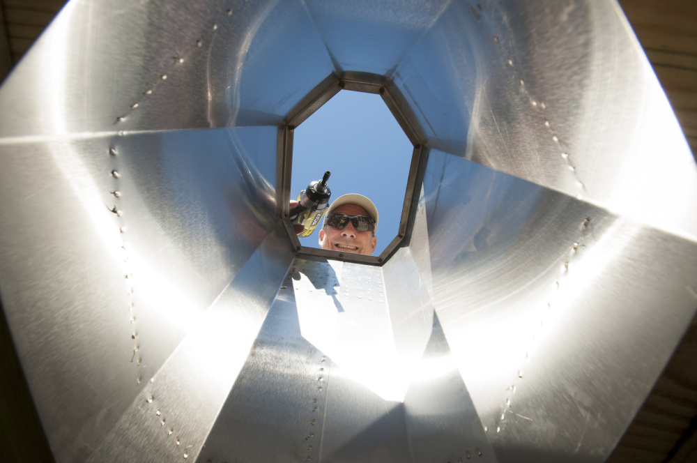 Doug Doken of Hollis appears through the throne as it's fitted into a privy that the Maine Appalachian Trail Club is building as a demonstration project. It will eventually be placed on the Appalachian Trail West Kerry Pond Camp near Caratunk.