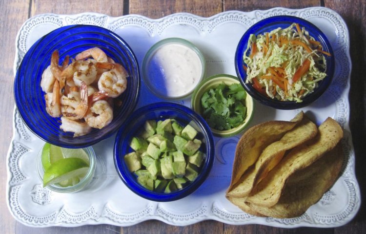 Ingredients for crispy shrimp tacos with coleslaw and chipotle cream.