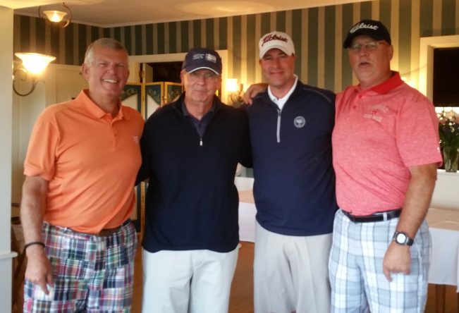 Men's 1st Place Flight A winners, from left, are Curt Haley, Rick Walker (master of ceremony), Jamie Eastlack and Jeff Richard. Missing from photo is Brad Stokes.