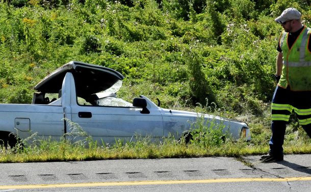 A tow truck operator prepares to remove this heavily damaged truck that left I-95 and ended in the median strip near the Western Avenue exit in Fairfield on Tuesday.