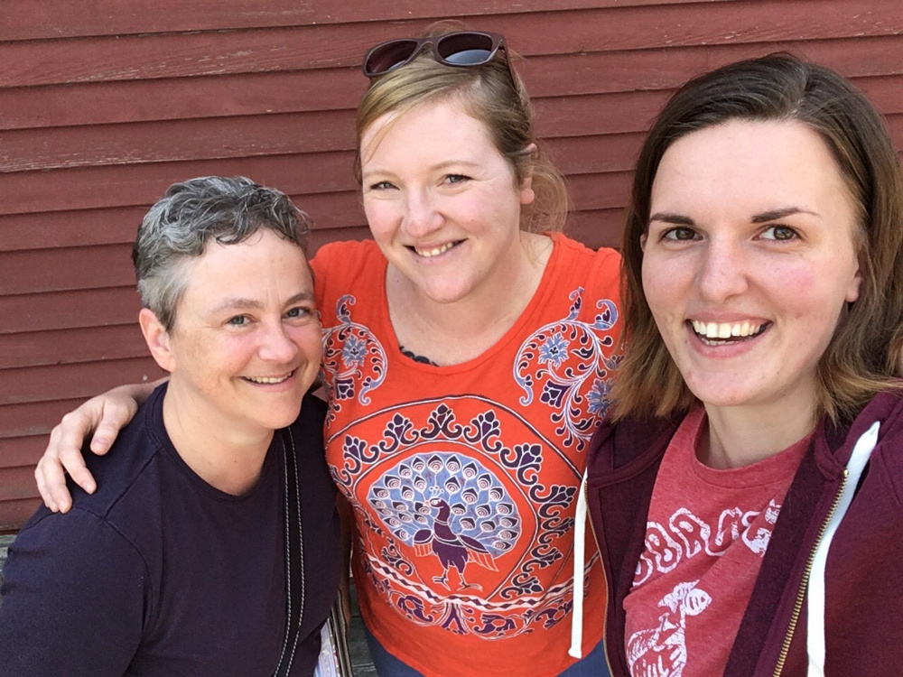 Harlow Gallery Executive Director Deb Fahy, Gallery Manager Cassie Bouton and Marketing Manager Allison McKeen pose in front of the gallery's new home on Water Street.