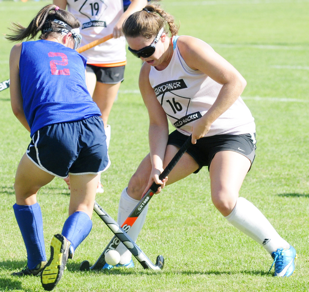 Gardiner's Jillian Bisson battles for a ball with Messalonskee's Chloe Tilley during am Aug. 24 scrimmage at Somerville Field in Gardiner.