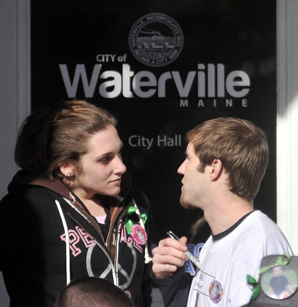 Trista Reynolds and Justin DiPietro speak on the steps of City Hall during a vigil in Castonguay Square in Waterville for their missing toddler, Ayla Reynolds.