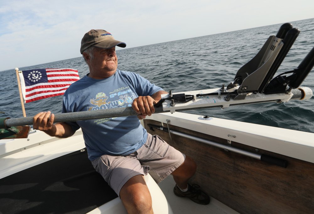 Shipwreck enthusiast Steve Radovan, of Sheboygan, Wis., stows a sonar transducer on his boat Wednesday, Aug. 9, 2017 in Lake Michigan. An avid underwater explorer since the mid-1970's and discoverer of sunken ships, Radovan is a strong advocate for a proposed national marine sanctuary for Lake Michigan. (Chris Walker/Chicago Tribune/TNS)