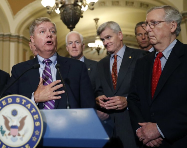 Sen. Lindsey Graham, R-S.C., speaks to the media, accompanied by Senate Majority Whip Sen. John Cornyn, R-Texas, Sen. Bill Cassidy, R-La., Sen. John Thune, R-S.D., and Senate Majority Leader Mitch McConnell of Ky., on Capitol Hill, Tuesday, Sept. 19, 2017, in Washington.  Photo/Alex Brandon)