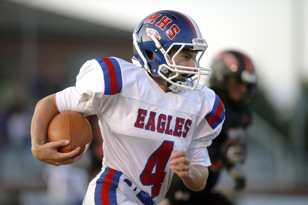 Messalonskee quarterback Deklan Thurston runs the ball against Brunswick during a Pine Tree Conference B game Friday in Brunswick.